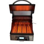Barbacoa eléctrica InfraBeam - Beefeater encendida, mostrando su sistema de infrarrojos en acción.