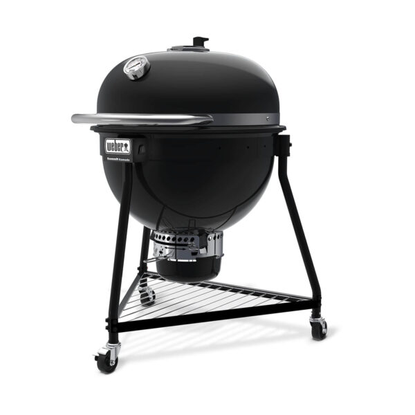 Barbacoa Summit Kamado E6 de Weber en negro con tapa cerrada y termómetro integrado.