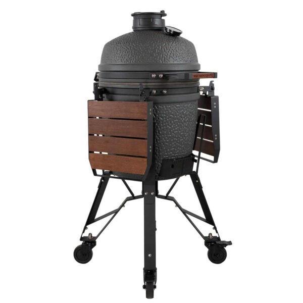 Kamado VX Medium con mesas auxiliares plegadas visto desde un lateral.