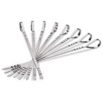 Set of reusable stainless steel skewers with flat design and ergonomic grip ring, arranged in a fan shape.