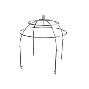 OFYR black steel cage with food hung over a barbecue, surrounded by tables with cooking utensils at an outdoor event with lawn.
