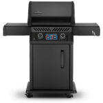 Napoleon Rogue EQ 365 electric barbecue with illuminated digital display, illuminated rotary controls and fold out side shelves.