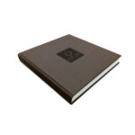 OFYR Cookbook closed, with brown cover and brand logo in the centre.