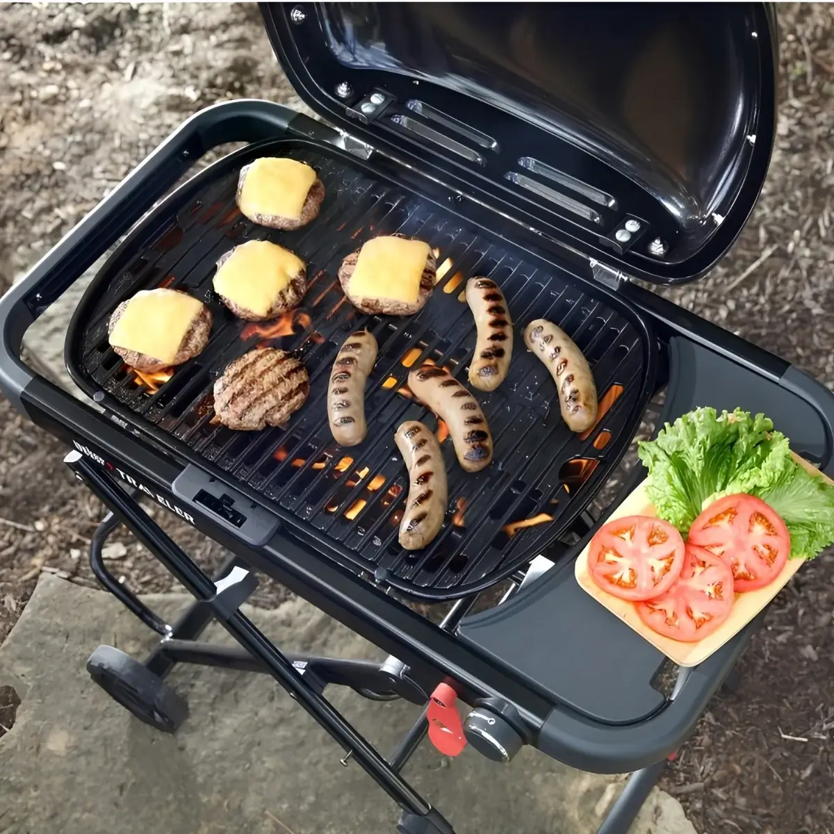 Weber Traveler Compact cooking surface with burgers and sausages